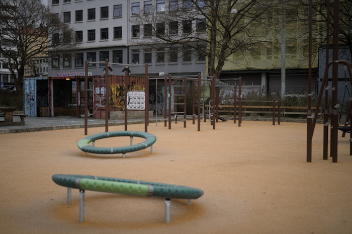 Outdoor gym with various horizontal bars, dip bars, monkey bars and rings.